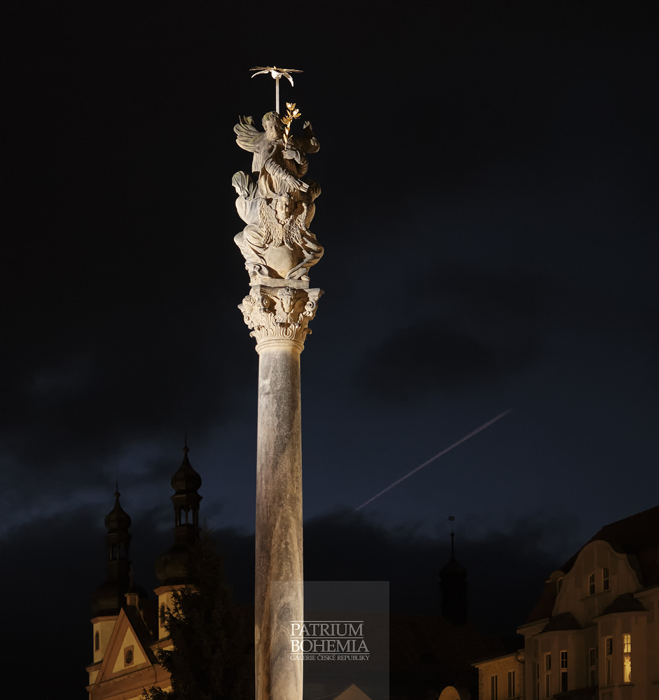 The top of the column with the sculpture of the Holy Trinity. Chomutov.