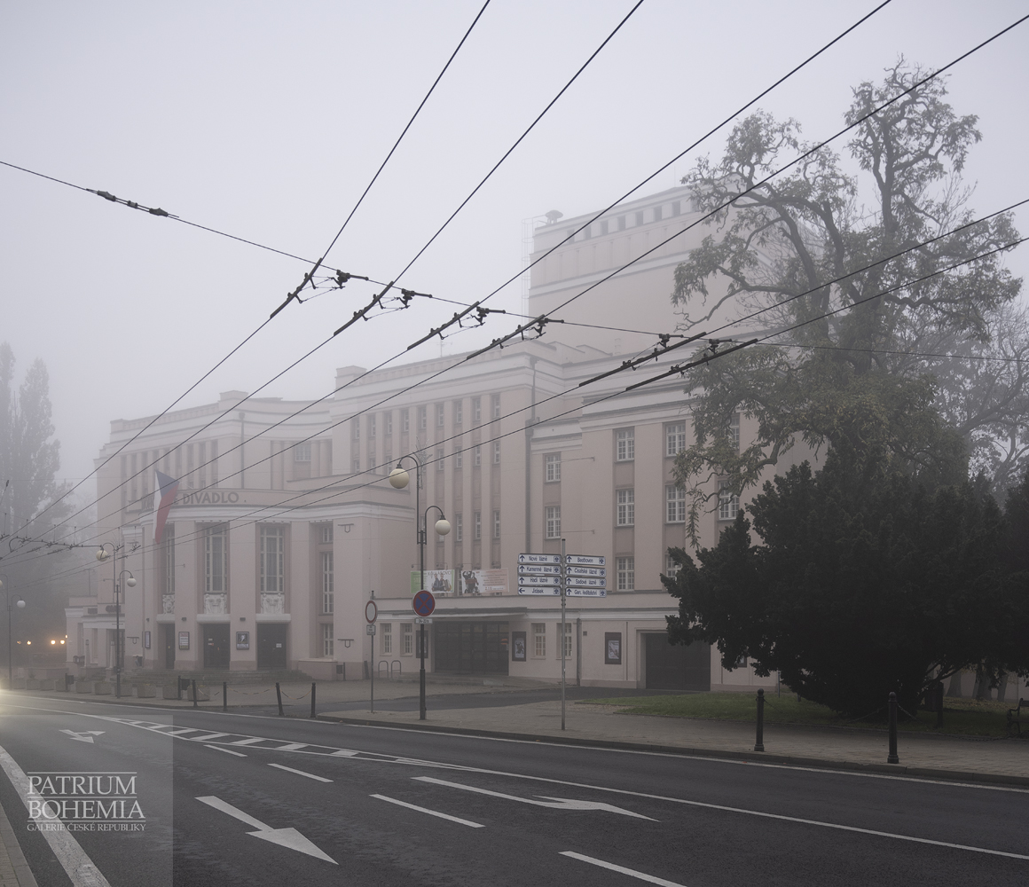 The Krusnohorske theater behind the web of the trolleys of trolleybuses. U Cisarskych lazni street. Teplice.